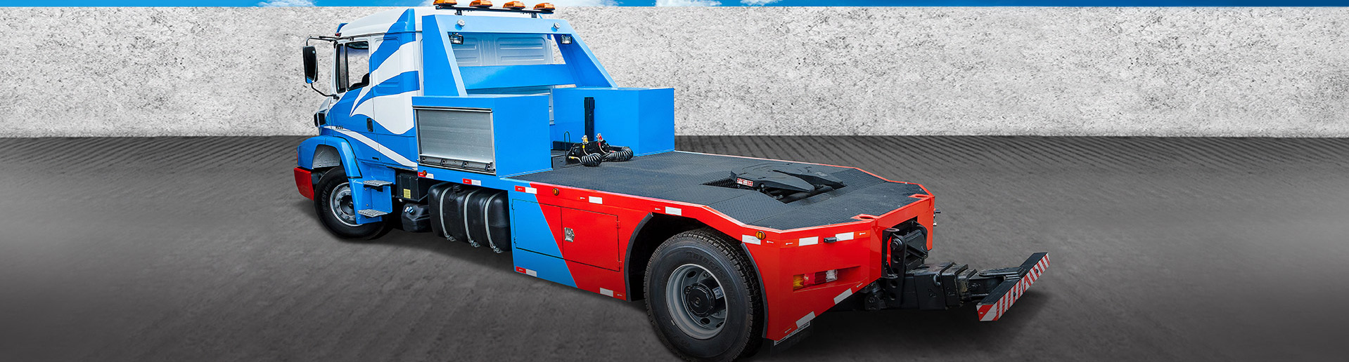 Caminhão de resgate pesado da JZ, azul, branco e vermelho, com plataforma e lança